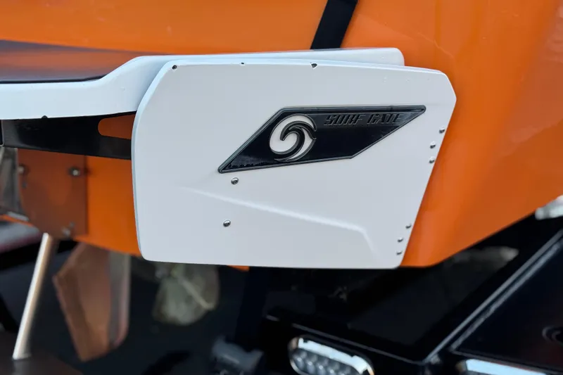 Slide: The Image of 2023 Axis T220 boat with Surf Gate feature, orange and white design. - 7