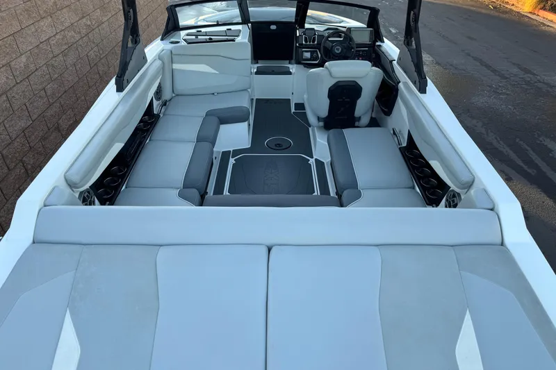 Slide: The Image of 2023 Axis T220 boat interior with spacious seating and modern dashboard design. - 9