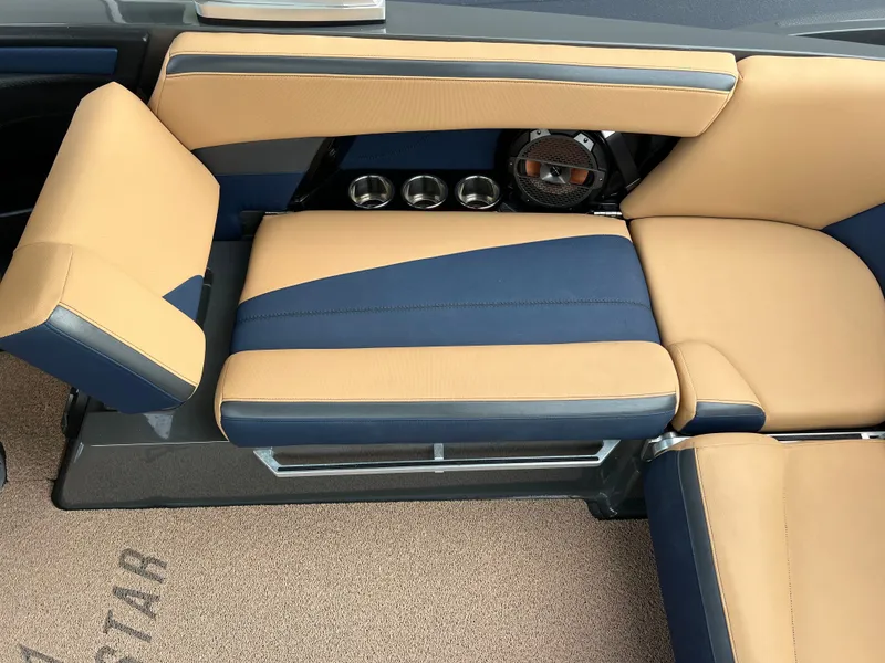 Slide: The Image of Interior of a 2019 MasterCraft XStar with beige and blue seating. - 21