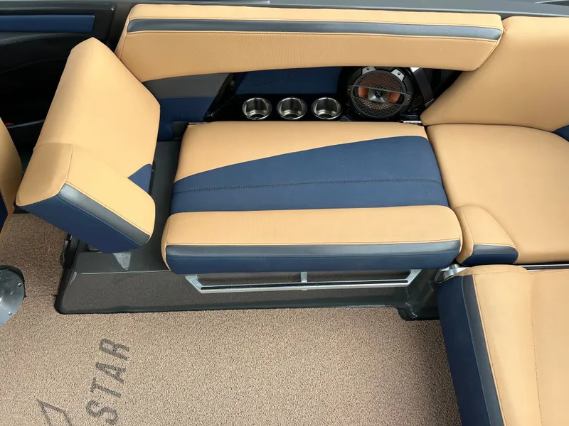 Slide: The Image of Interior of a 2019 MasterCraft XStar with beige and blue seating. - 22