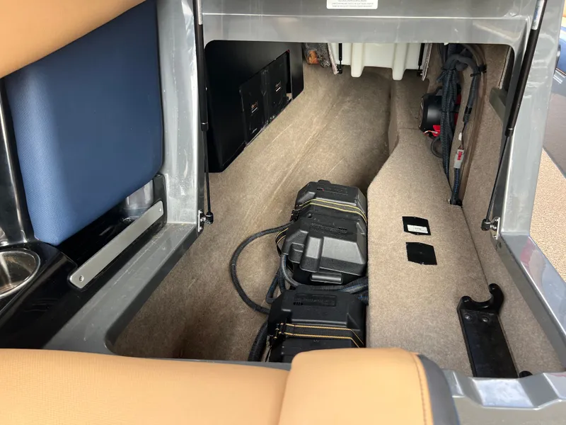 Slide: The Image of Interior of a 2019 MasterCraft XStar boat with storage space. - 37