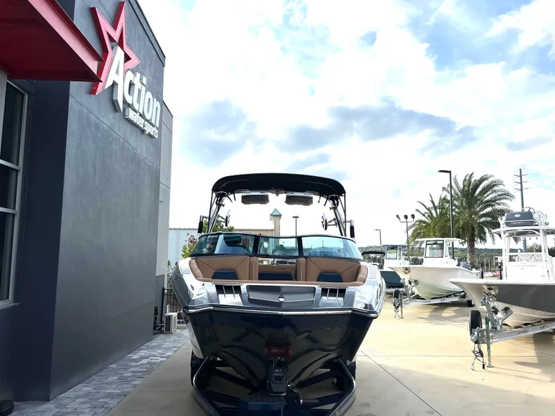 Slide: The Image of 2019 MasterCraft XStar in front of Action Watersports store. - 9
