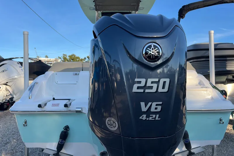 Slide: The Image of 2026 Key West 219 FS boat with Yamaha 250 V6 4.2L engine, rear view. - 1
