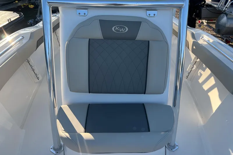 Slide: The Image of 2026 Key West 219 FS boat seat with gray and white upholstery. - 10
