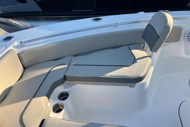 Slide: The Image of 2026 Key West 219 FS boat interior with cushioned seating and cup holders. - 14