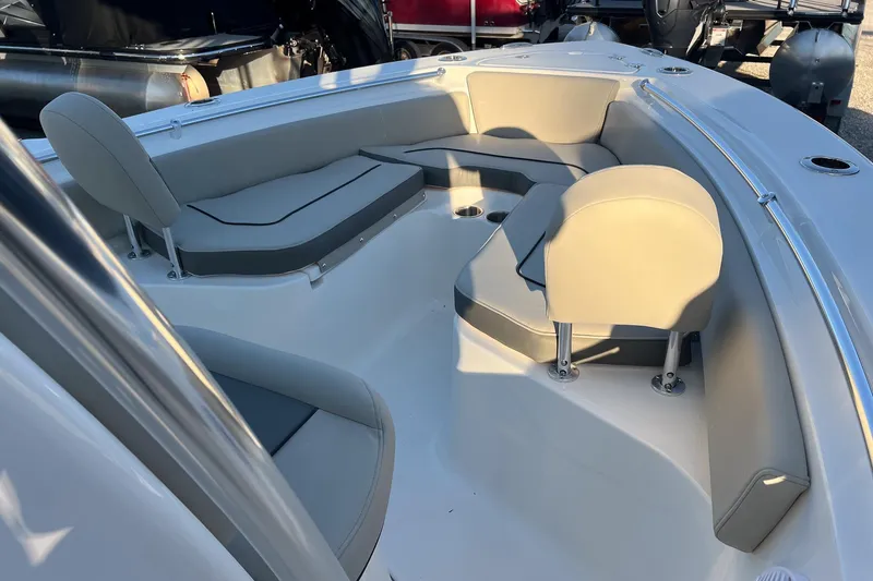 Slide: The Image of 2026 Key West 219 FS boat interior with cushioned seating and sleek design. - 15