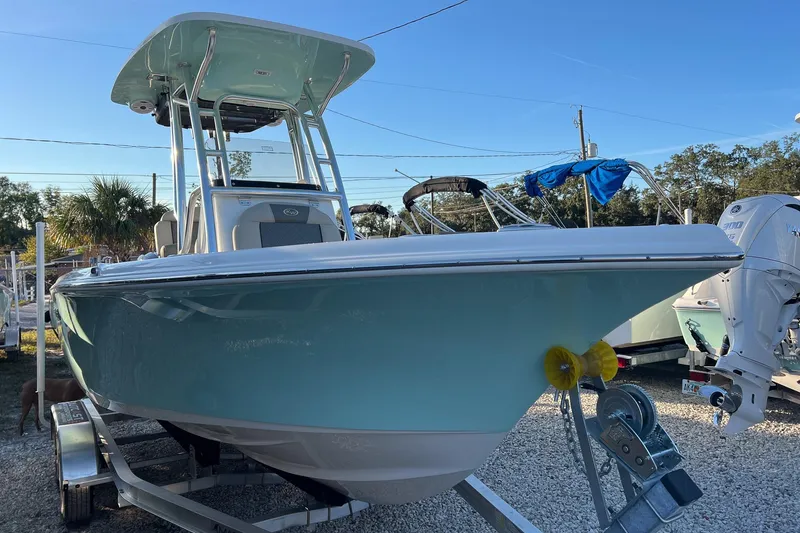 Slide: The Image of 2026 Key West 219 FS boat on trailer, displayed outdoors under clear sky. - 3