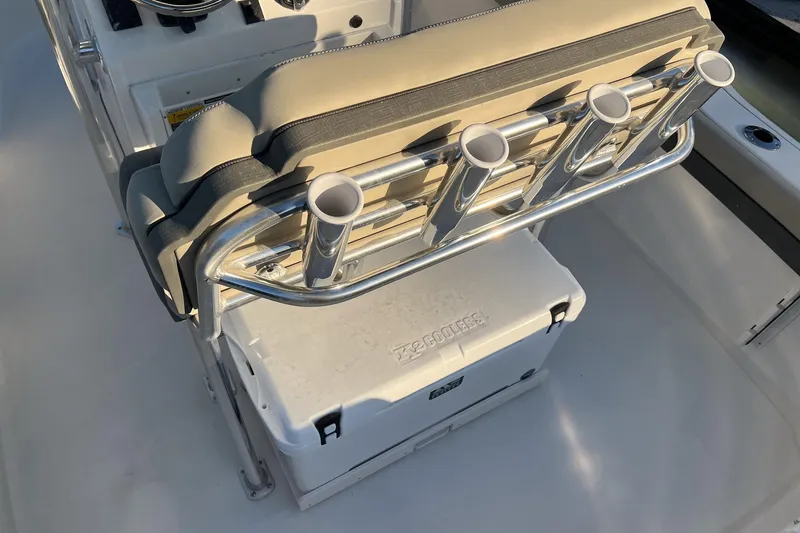 Slide: The Image of 2026 Key West 219 FS boat interior with rod holders and cooler storage. - 6