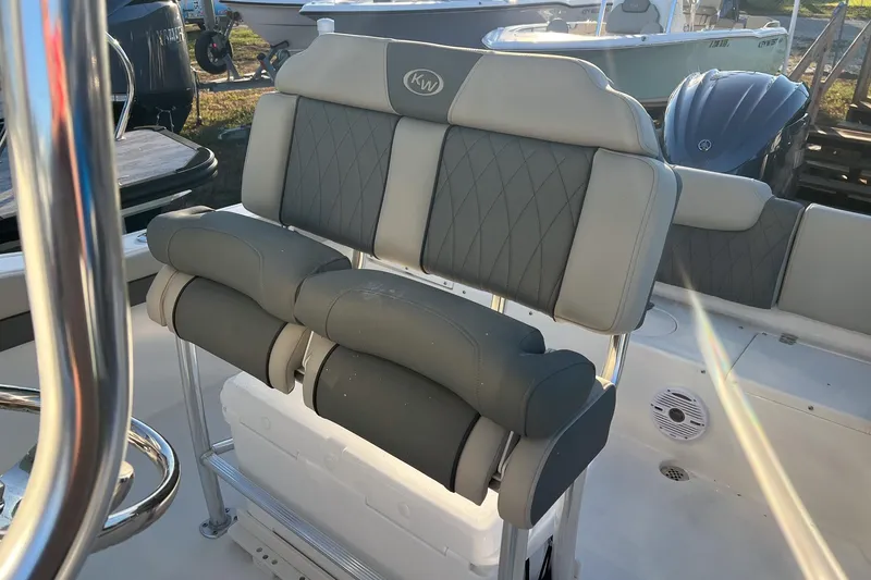Slide: The Image of 2026 Key West 219 FS boat seating with gray cushioned upholstery and stainless steel frame. - 8