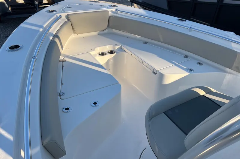 Slide: The Image of 2026 Key West 219 FS boat interior with seating and storage compartments. - 9