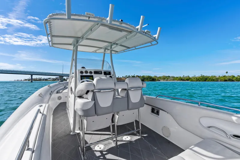 Slide: The Image of Airship 330 boat interior, 2014 model, on blue water with clear sky and bridge. - 15