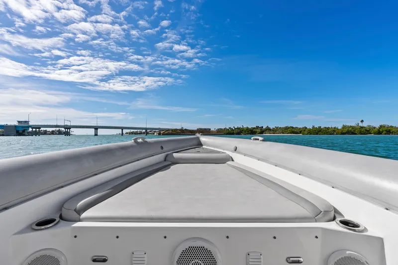 Slide: The Image of Bow view of 2014 Airship 330 boat under clear blue sky. - 7