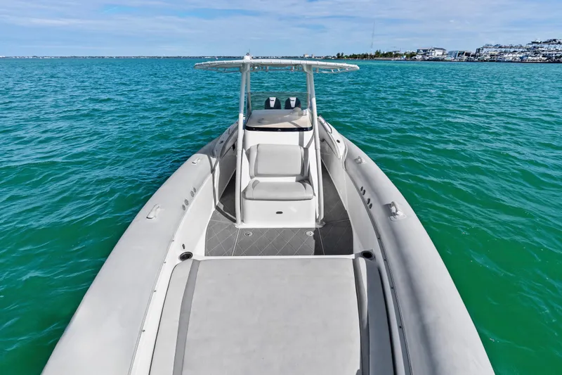 Slide: The Image of Airship 330 boat on turquoise water, 2014 model, clear sky background. - 8