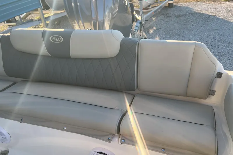 Slide: The Image of 2026 Key West 219 FS boat seat with quilted design and sunlight reflection. - 11