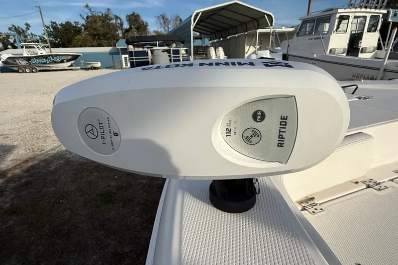 Slide: The Image of Minn Kota Riptide motor on 2023 Robalo 226 Cayman boat deck. - 11