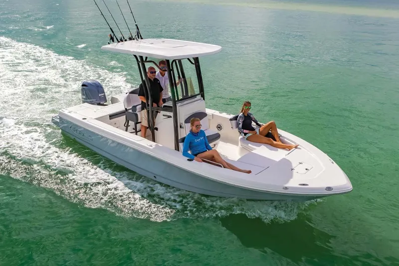 Slide: The Image of Manufacturer Provided Image: 2023 Robalo 226 Cayman boat cruising with passengers on clear water. - 13