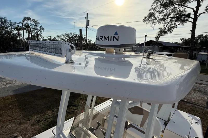 Slide: The Image of 2023 Robalo 226 Cayman boat with Garmin radar and LED light bar on top. - 9