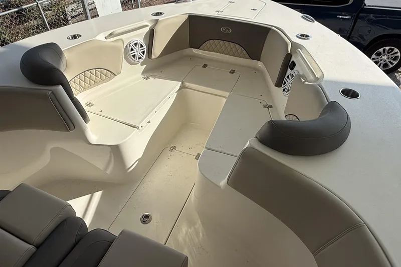 Slide: The Image of 2025 Key West 291 FS boat interior with cushioned seating and storage compartments. - 5