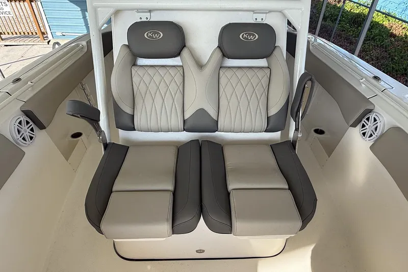 Slide: The Image of 2025 Key West 291 FS boat seating with elegant, cushioned design and integrated armrests. - 6