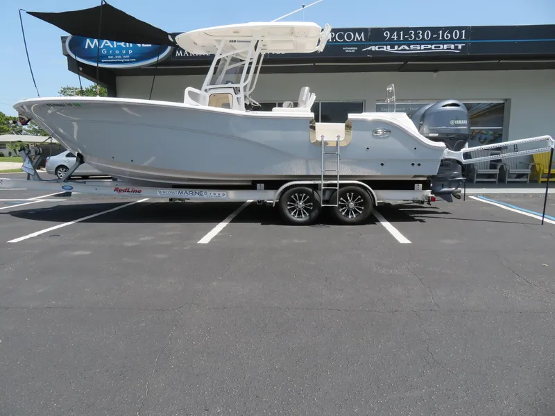 Slide: The Image of 2022 Sea Fox 268 Commander on trailer outside a marine dealership. - 13