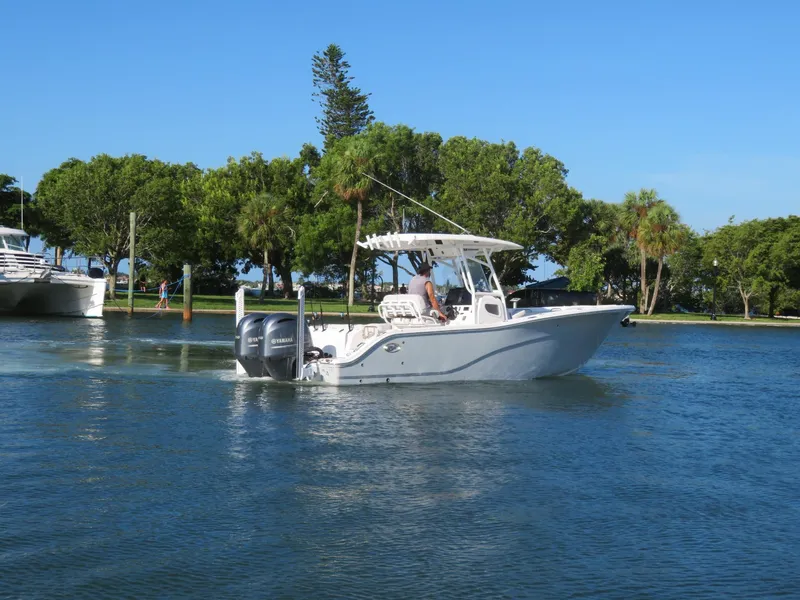 Slide: The Image of 2022 Sea Fox 268 Commander on calm water near trees. - 4