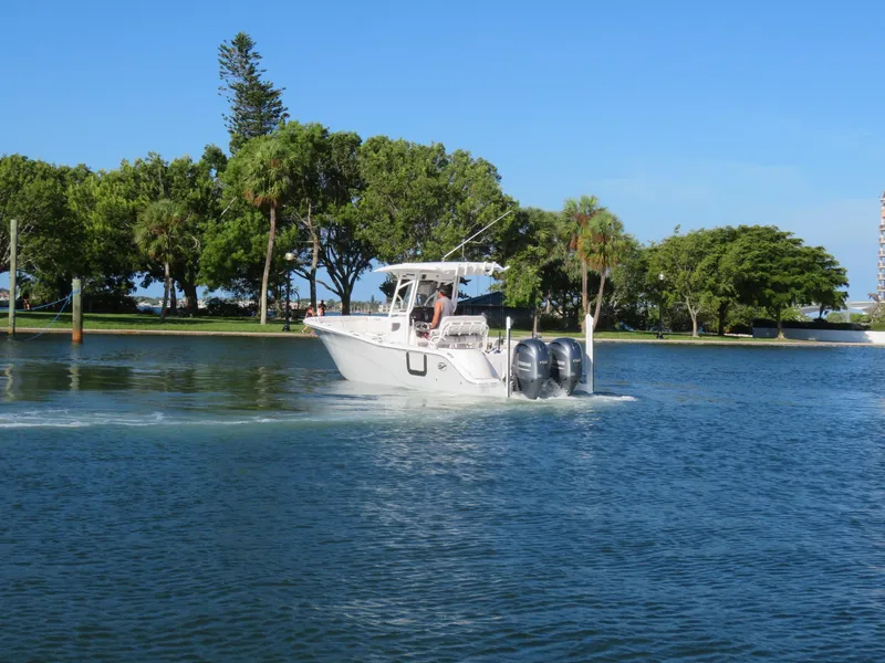 Slide: The Image of 2022 Sea Fox 268 Commander on calm water with green backdrop. - 6
