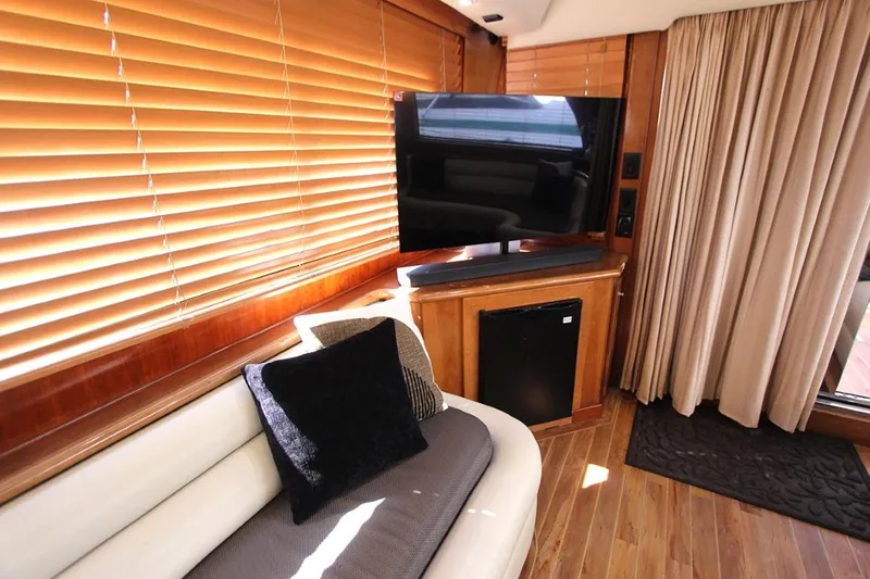 Slide: The Image of Wooden kitchen cabinets in a 2006 Navigator 5400, with dishes and pantry items. - 10