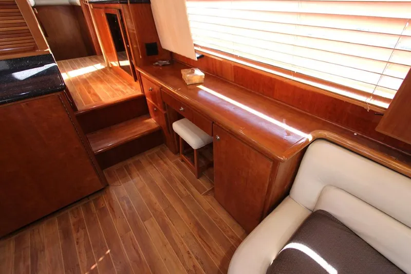 Slide: The Image of Luxurious interior of 2006 Navigator 5400 yacht with modern kitchen and cozy seating area. - 12