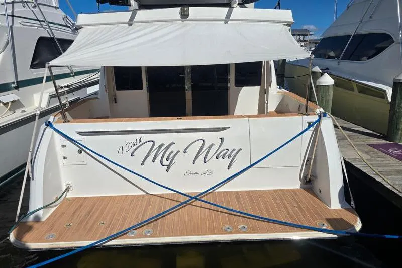 Slide: The Image of Navigator 5400 yacht, 2006 model, docked with "I Did It My Way" on the stern. - 41