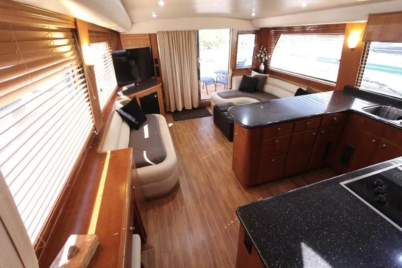 Slide: The Image of Luxurious 2006 Navigator 5400 yacht kitchen with sleek wood cabinetry and modern appliances. - 9