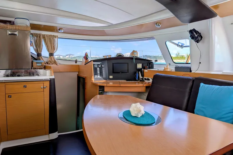 Slide: The Image of Interior of 2012 Fountaine Pajot Lipari Owners Version catamaran, featuring modern kitchen and seating area. - 22