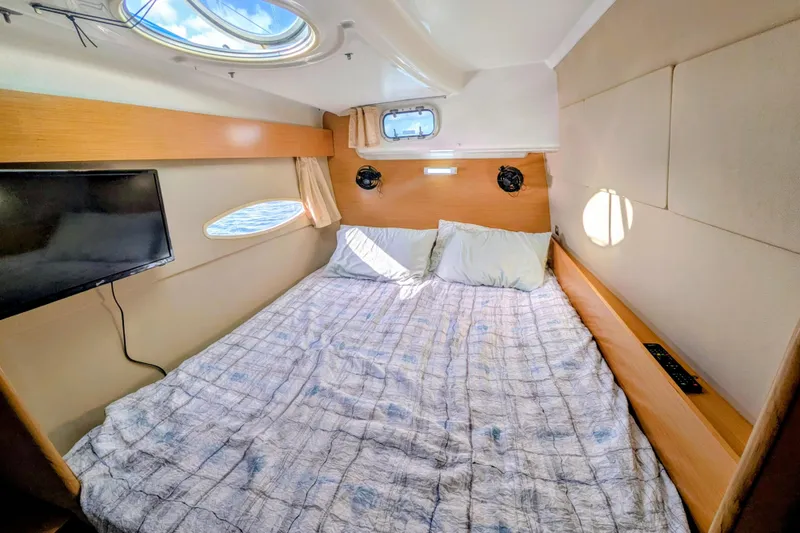 Slide: The Image of Cozy cabin interior of 2012 Fountaine Pajot Lipari catamaran with bed and porthole views. - 28