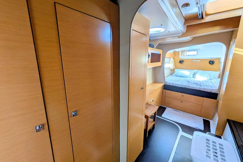 Slide: The Image of Interior of 2012 Fountaine Pajot Lipari catamaran, featuring cozy bedroom and wooden cabinetry. - 29