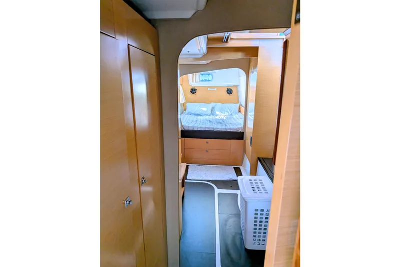 Slide: The Image of Interior of 2012 Fountaine Pajot Lipari catamaran, featuring cozy bedroom and wooden cabinetry. - 36