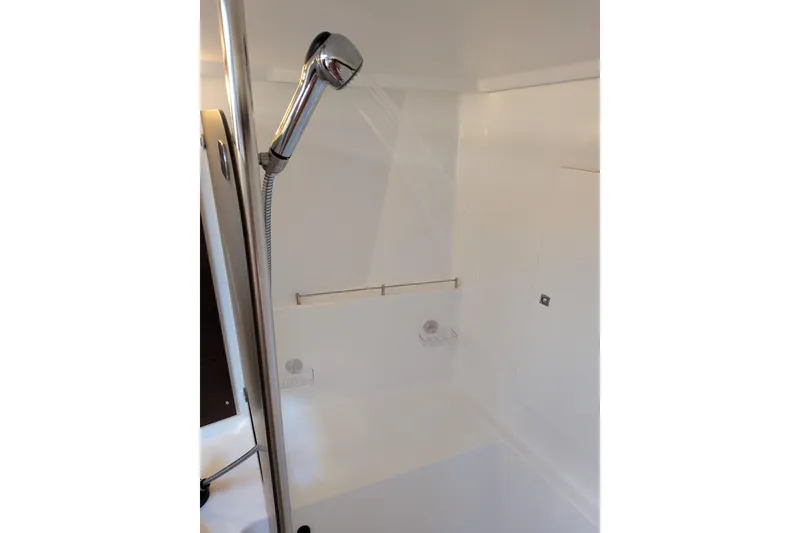 Slide: The Image of Shower area in 2012 Fountaine Pajot Lipari catamaran, featuring a handheld showerhead. - 38