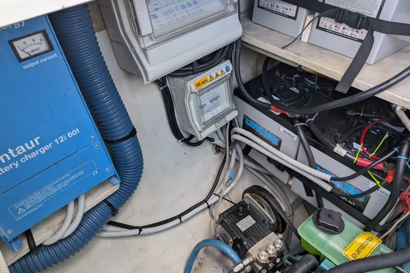 Slide: The Image of Electrical system of a 2012 Fountaine Pajot Lipari catamaran, featuring battery charger and wiring. - 46