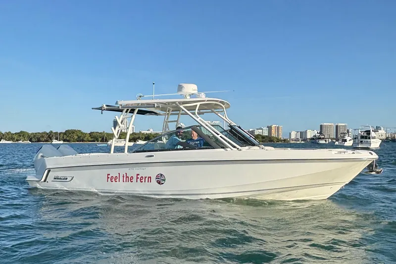 The Image of 2020 Boston Whaler 270 Vantage boat cruising on a sunny day, labeled "Feel the Fern." - 0