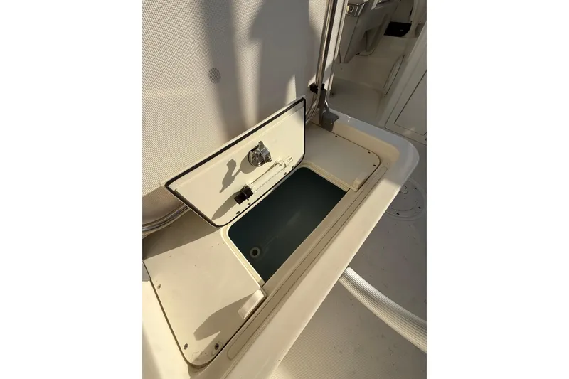 Slide: The Image of Open storage compartment on 2020 Boston Whaler 270 Vantage boat. - 13
