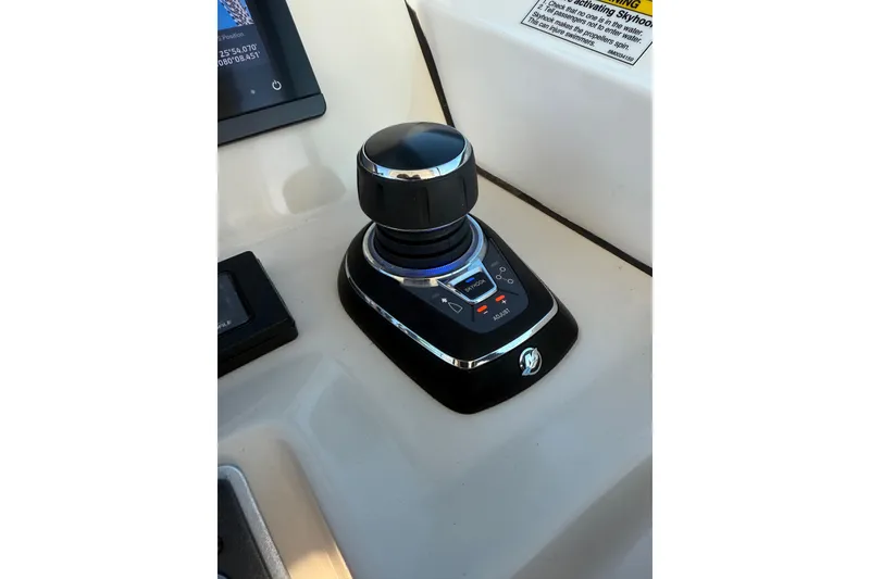 Slide: The Image of Joystick control on 2020 Boston Whaler 270 Vantage boat dashboard. - 21
