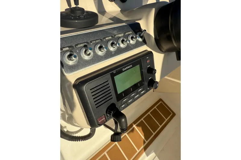 Slide: The Image of Control panel of 2020 Boston Whaler 270 Vantage with Garmin marine radio. - 25