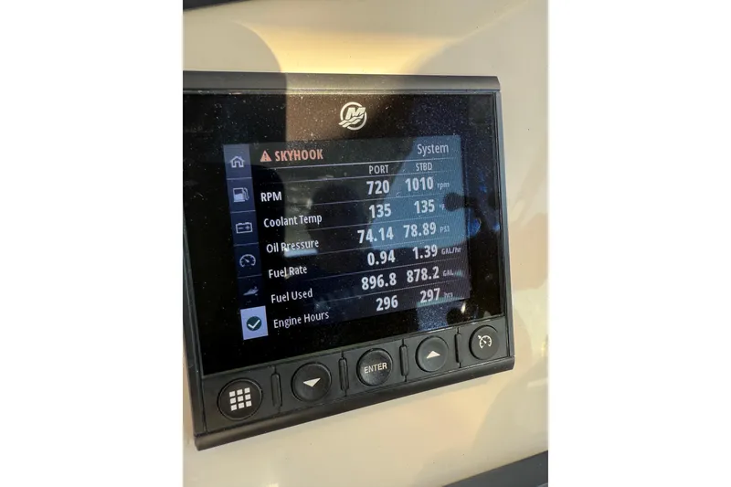 Slide: The Image of Dashboard display of a 2020 Boston Whaler 270 Vantage boat showing engine metrics. - 26