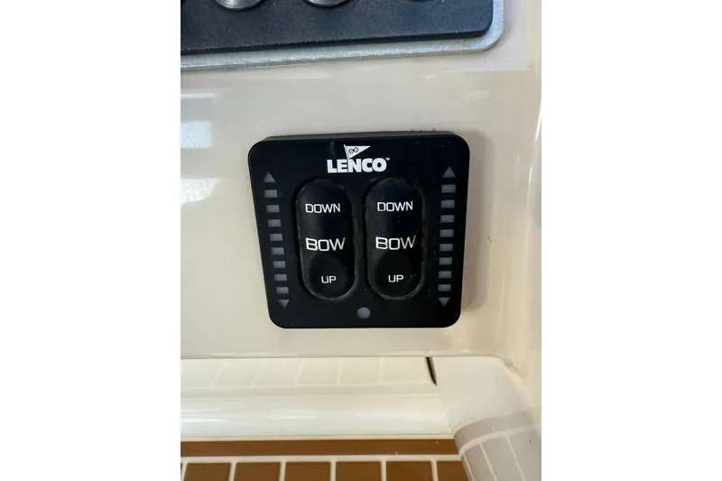 Slide: The Image of Lenco trim tab control on 2020 Boston Whaler 270 Vantage boat dashboard. - 28