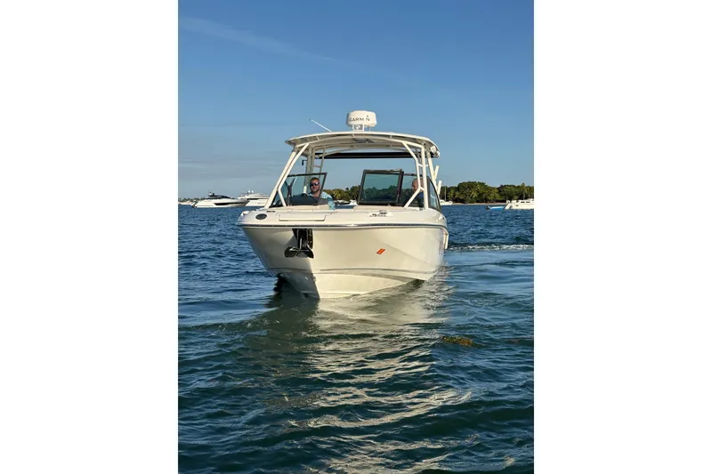Slide: The Image of 2020 Boston Whaler 270 Vantage boat cruising on open water. - 3