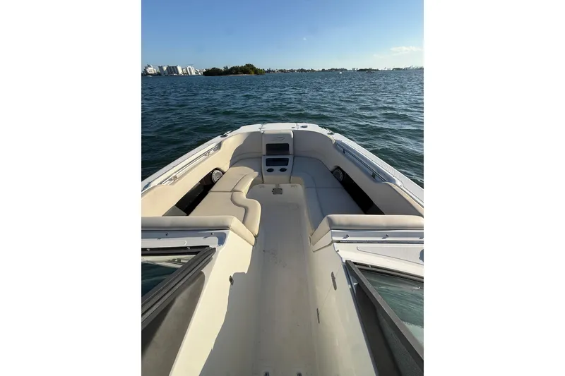 Slide: The Image of 2020 Boston Whaler 270 Vantage boat interior with seating, on calm water. - 5