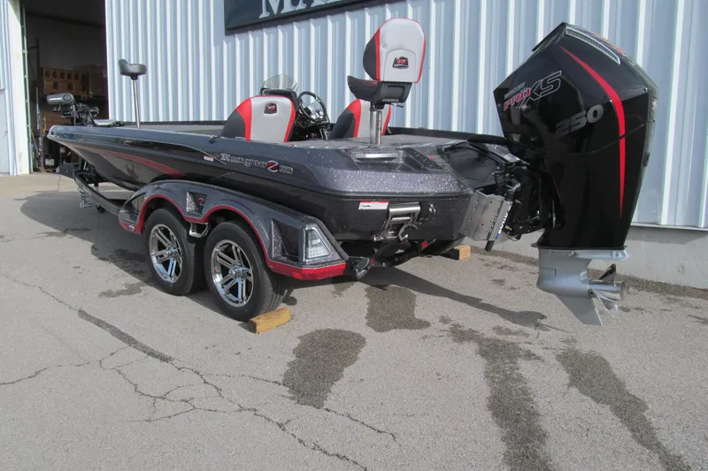 Slide: The Image of 2026 Ranger Z520 boat with Mercury Pro XS 250 engine, parked outside a building. - 2