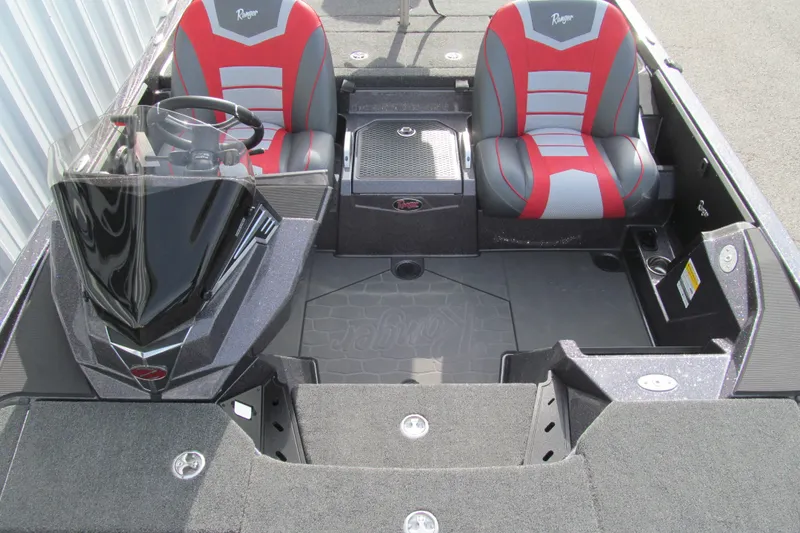 Slide: The Image of 2026 Ranger Z520 boat interior with red and gray seats, steering wheel, and console. - 9
