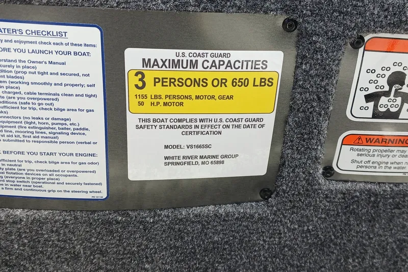 Slide: The Image of U.S. Coast Guard capacity label for Ranger VS1665SC boat, 2026 model, 3 persons or 650 lbs. - 10