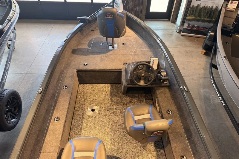Slide: The Image of 2026 Ranger VS1665SC fishing boat interior with steering console and seating. - 6
