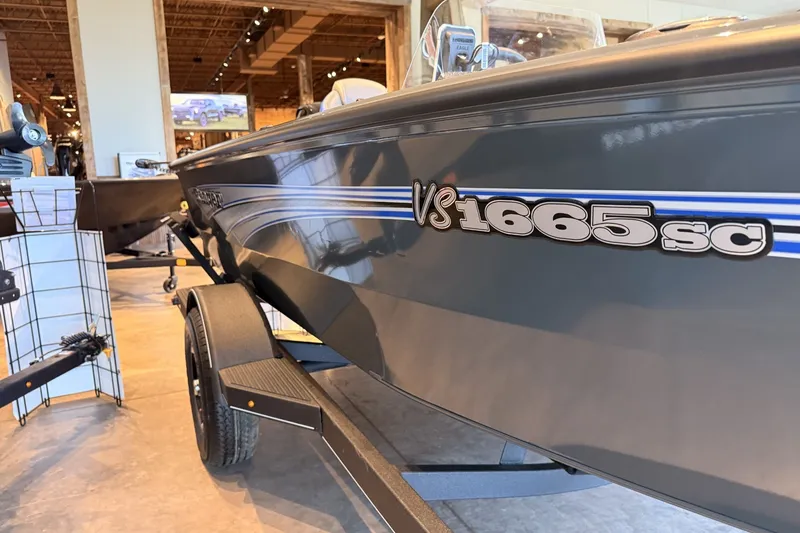 Slide: The Image of 2026 Ranger VS1665SC boat displayed indoors on a trailer. - 4