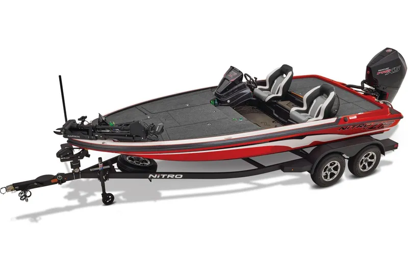 Slide: The Image of 2026 Nitro Z19 XL boat with powerful engine, parked outdoors on a sunny day. - 2